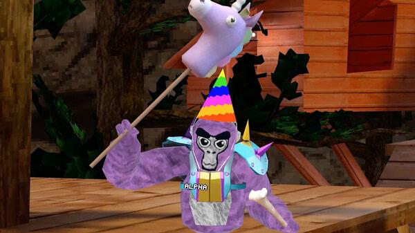 Gorilla Tag screenshot: A gorilla wearing a rainbow party hat holds a unicorn stick in a colorful forest setting.