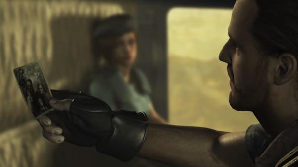Resident Evil HD Remaster screenshot: A character holds a photo while another, wearing a blue uniform, stands in the background.