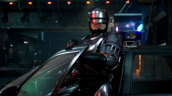 Screenshot from RoboCop: Rogue City showing RoboCop leaning on a patrol car in a dimly lit urban street scene.