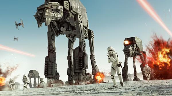 STAR WARS Battlefront II screenshot: Stormtroopers and AT-ATs advancing amid explosions and laser fire on a snowy battlefield.