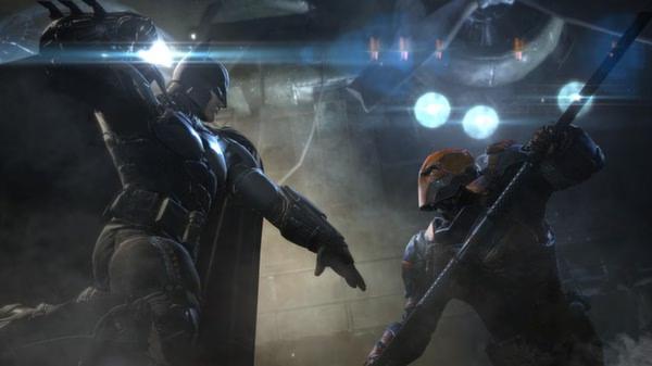 Batman: Arkham Origins screenshot showing Batman in combat with an armored opponent in a dimly lit industrial setting.