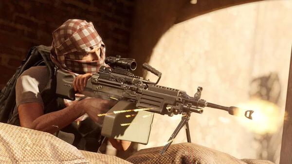 Screenshot from Insurgency: Sandstorm showing a player character firing a machine gun from behind cover in a sunlit environment.