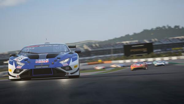 Race cars speeding on a track in Assetto Corsa Competizione. The screenshot shows a close-up of a blue car in front.