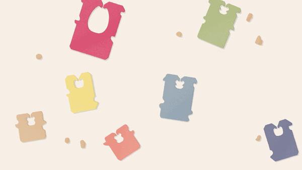 Screenshot from 'A Little to the Left' showing various colorful bread clips scattered randomly on a light background.