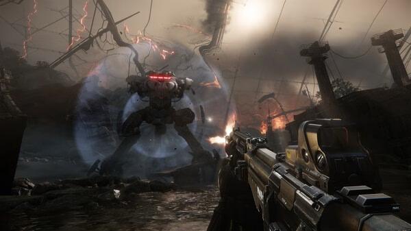 Crysis 3 Remastered screenshot: A player aims a futuristic rifle at a large mech surrounded by energy in a war-torn environment.