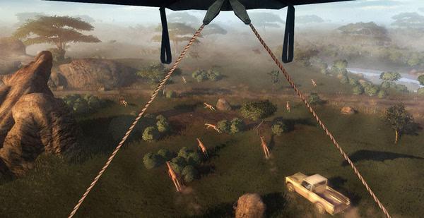 Far Cry 2 screenshot: A view from above shows a truck driving through a grassy savanna with deer scattered around.