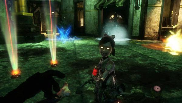 BioShock 2 screenshot: A Little Sister kneels beside a fallen Big Daddy in a dimly lit room with glowing lights and electric effects.