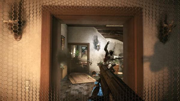Crysis 2 Remastered screenshot: A player aims a rifle at an enemy in a damaged room, with smoke and debris visible through a mesh barrier.