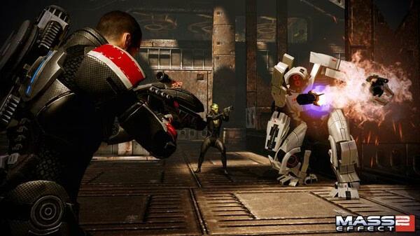 Mass Effect 2 screenshot: Characters engage in battle with a large mech in an industrial setting.