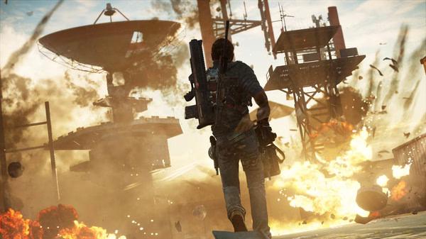 Screenshot from Just Cause 3 showing the protagonist running amidst explosions and satellite dishes in a chaotic setting.