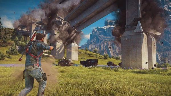 Just Cause 3 screenshot: A character with a weapon causing a bridge explosion, debris flying, and vehicles in the background.