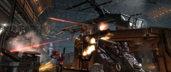 A screenshot from Wolfenstein: The New Order showing intense gunfire as a player battles enemies in a hangar.