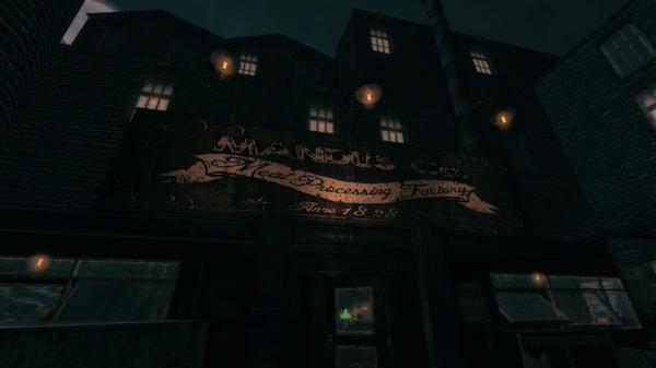 Screenshot from Amnesia: A Machine for Pigs showing the Mandus Co. Meat Processing Factory at night with glowing lights and dark buildings.
