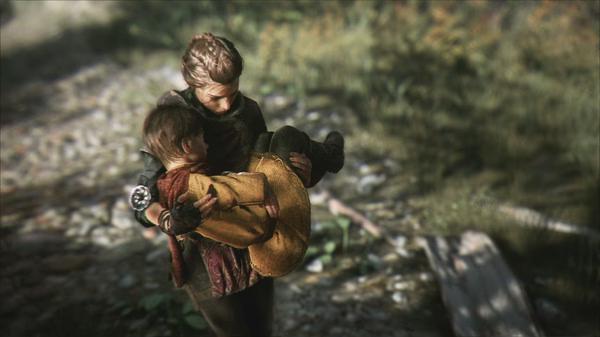 Screenshot from A Plague Tale: Innocence showing a person carrying a child through a forest path, surrounded by greenery.