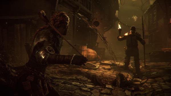 Screenshot from A Plague Tale: Innocence showing a character stealthily approaching a guard holding a torch in a dimly lit street.