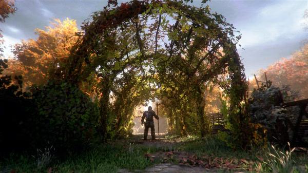 A screenshot from A Plague Tale: Innocence showing a character standing under a leafy archway in a vibrant autumn setting.