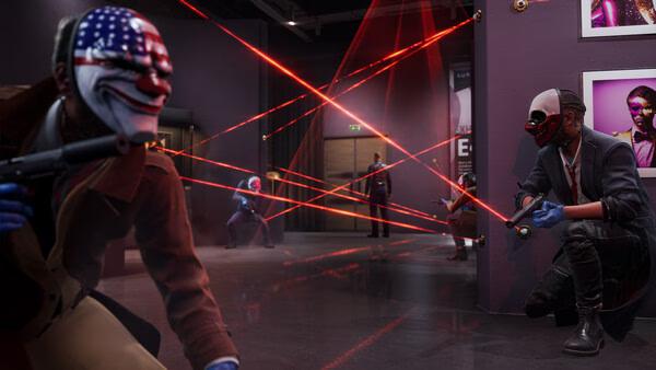 PAYDAY 3 screenshot: Players in iconic masks strategize in a dimly lit room, dodging laser security systems.