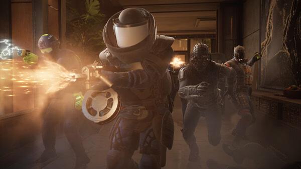 PAYDAY 3 screenshot: Group of armed characters in tactical gear, one firing a weapon with visible muzzle flash in a dimly lit corridor.