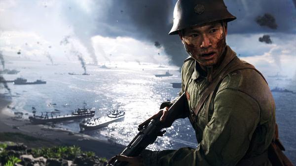 A Battlefield V screenshot showing a soldier holding a rifle, overlooking a battlefield with ships and smoke-filled skies in the distance.
