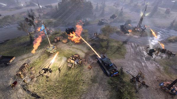 Screenshot from Company of Heroes 3 showing a tank firing at enemy forces amidst a battlefield with explosions and scattered debris.