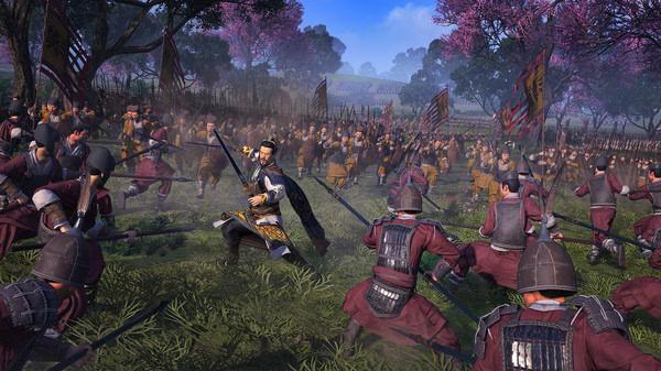 Screenshot of Total War: Three Kingdoms showing soldiers engaged in battle amidst blossoming trees.