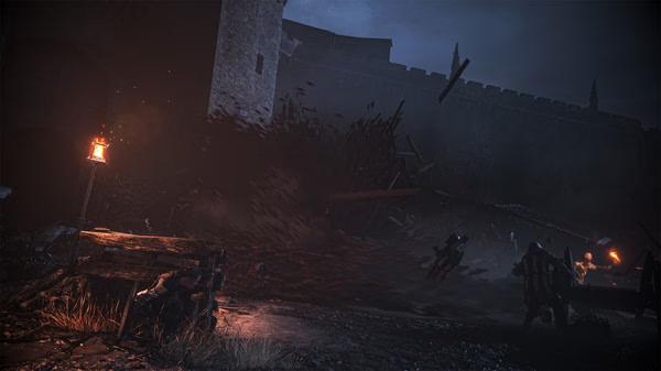 A Plague Tale: Requiem screenshot showing a dark scene with rats swarming near a torch-lit fortress wall at night.