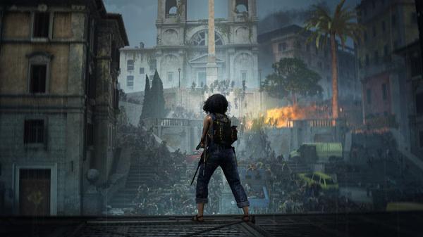 World War Z screenshot: A character stands on a rooftop, overlooking a massive horde of zombies attacking a burning city below.