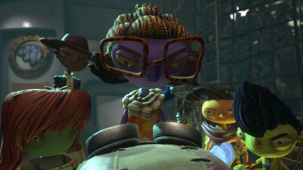 A screenshot from Psychonauts 2 showing a group of colorful characters gathered around a mysterious object indoors.
