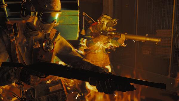 FBC: Firebreak screenshot showing two armored characters with weapons, surrounded by flames in an intense action scene.