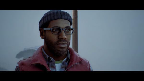 A screenshot from SILENT HILL: Townfall showing a man in glasses and a beanie standing outdoors in a foggy environment.