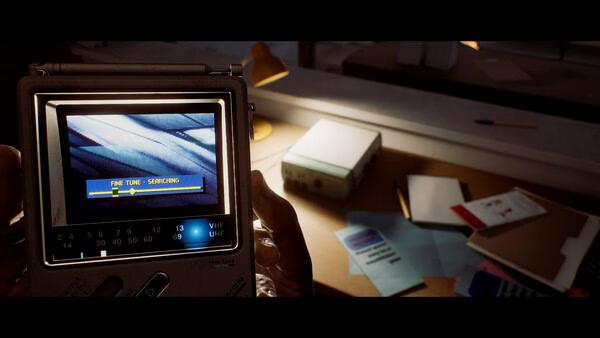 Screenshot from SILENT HILL: Townfall showing a handheld device displaying "FINE TUNE - SEARCHING" on a cluttered desk.