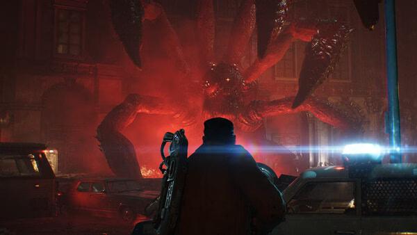 A Gears of War: E-Day screenshot showing a soldier facing a massive, red, multi-limbed creature in a city street at night.