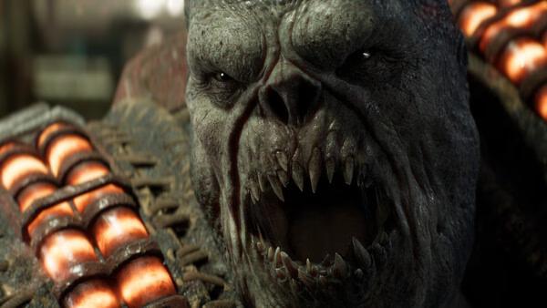 A close-up screenshot from Gears of War: E-Day showing a snarling Locust enemy with sharp teeth and glowing armor plates.