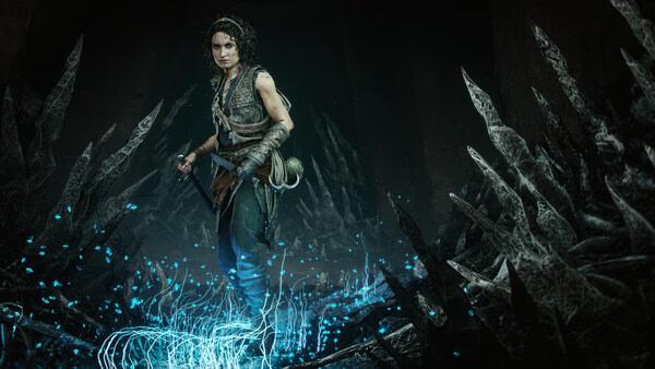 A screenshot from Resonance: A Plague Tale Legacy shows a character standing amidst glowing blue plants and jagged dark rocks.