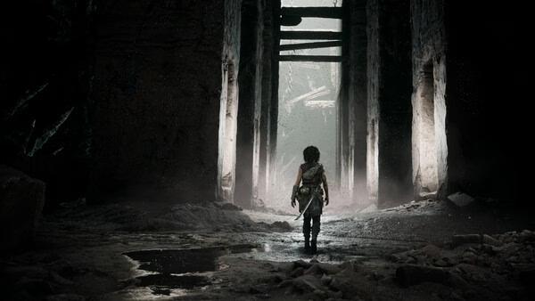 A screenshot from "Resonance: A Plague Tale Legacy" shows a lone figure with a sword walking through a dimly lit stone corridor.