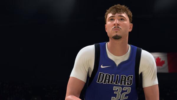 NBA 2K27 screenshot showing a basketball player in a Dallas jersey with the number 32, preparing to take a shot on a dimly lit court.