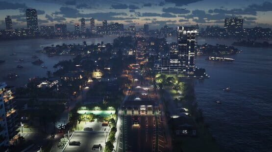 A Grand Theft Auto VI (PlayStation 5) screenshot showing a vibrant cityscape at night with lit buildings, roads, and waterfront views.