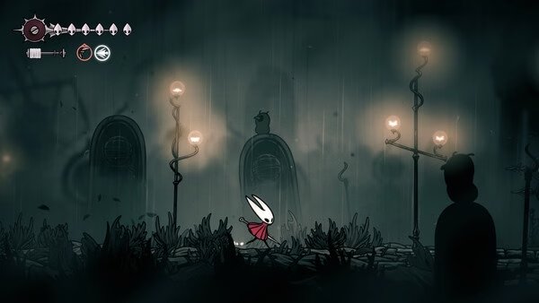 Screenshot from Hollow Knight: Silksong showing the protagonist Hornet walking through a dark, eerie environment with glowing lamps.