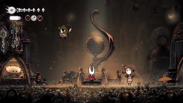Screenshot from Hollow Knight: Silksong showing Hornet surrounded by enemies in a dimly lit, intricate cavern setting.