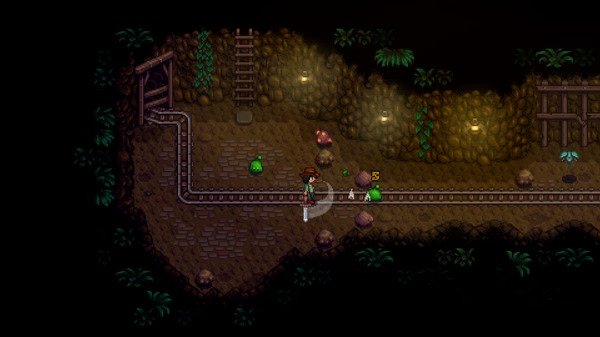 Stardew Valley screenshot: Player battles green slimes in a dimly lit cave with mine tracks and rocks scattered around.