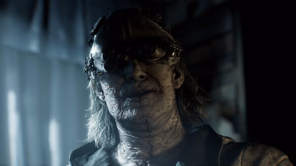 A screenshot from Resident Evil Requiem shows a sinister character with mechanical enhancements in a dimly lit environment.