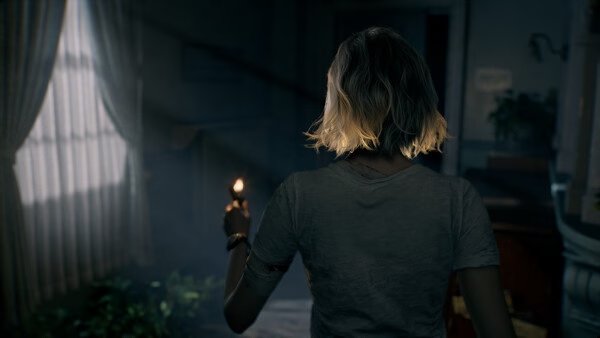 A screenshot from Resident Evil Requiem shows a character holding a lit candle, exploring a dimly lit, eerie room.