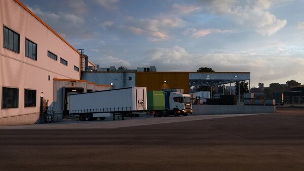 Euro Truck Simulator 2 screenshot showing a parked truck with a white trailer near a warehouse at sunset.