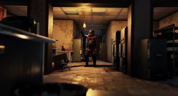 RUST screenshot: A player holding a torch stands in a dimly lit, abandoned office with scattered furniture and filing cabinets.