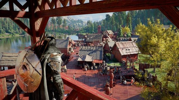 Crimson Desert screenshot: A warrior with a shield overlooks a vibrant village with wooden structures and a river in the background.