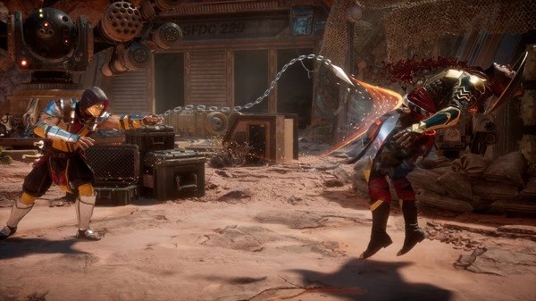 Screenshot from Mortal Kombat 11 showing a character using a chain weapon to attack an opponent in a desert setting.