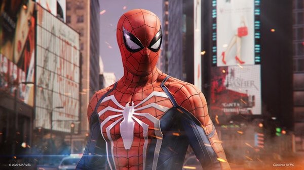 Spider-Man in his iconic suit stands in a bustling city street in this screenshot from Marvel's Spider-Man Remastered.
