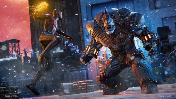 Marvel’s Spider-Man: Miles Morales screenshot showing Miles Morales battling Rhino in a snowy urban environment.