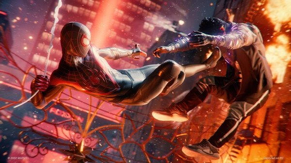 Screenshot from Marvel’s Spider-Man: Miles Morales showing Miles mid-air kicking an enemy in a dynamic cityscape.