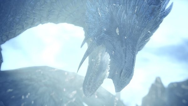 Screenshot from Monster Hunter World: Iceborne Master Edition showing a close-up of a fierce dragon against a snowy backdrop.